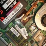 SSD vs HDD data recovery — SSD installed inside a laptop alongside the motherboard